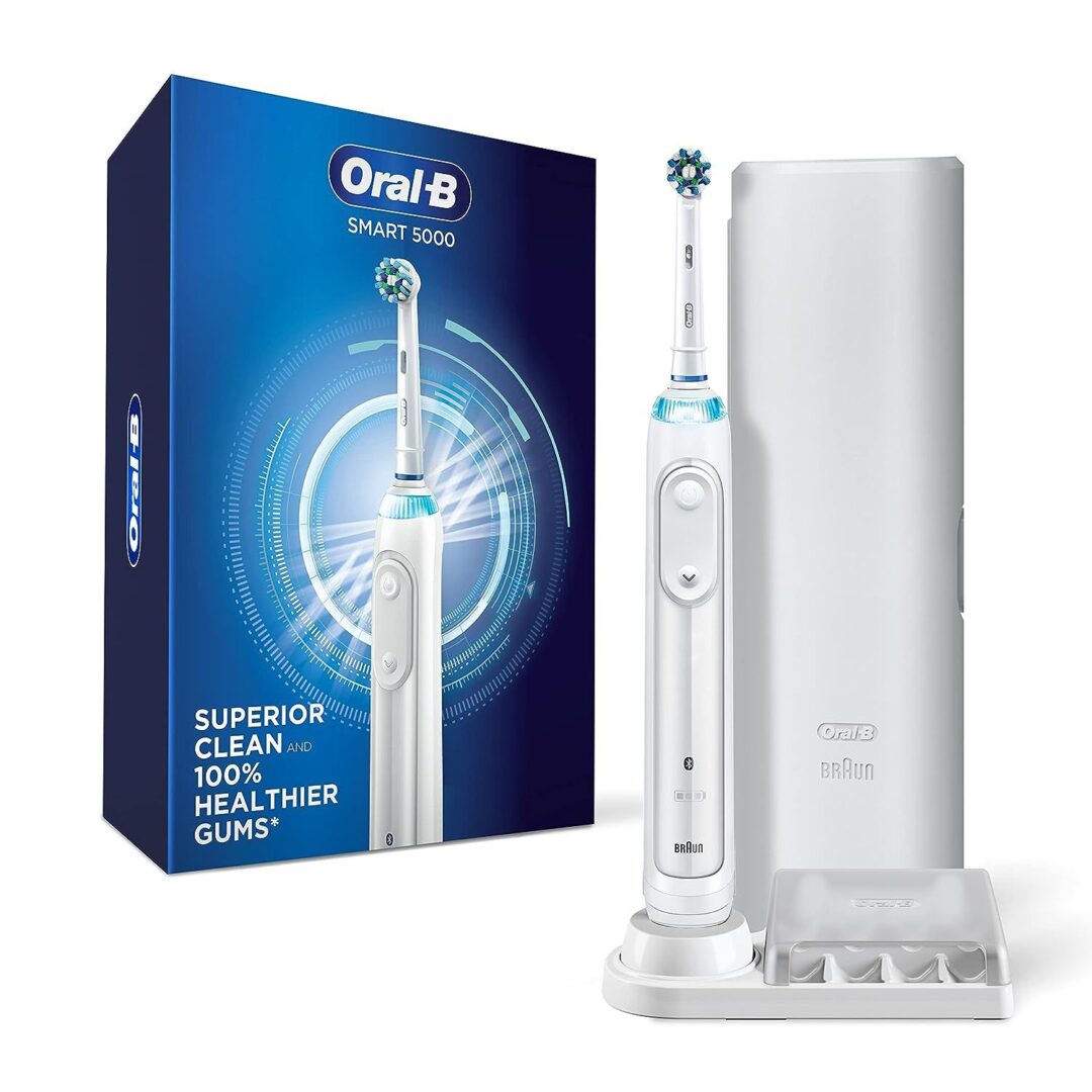 A white electric toothbrush and case on a table.